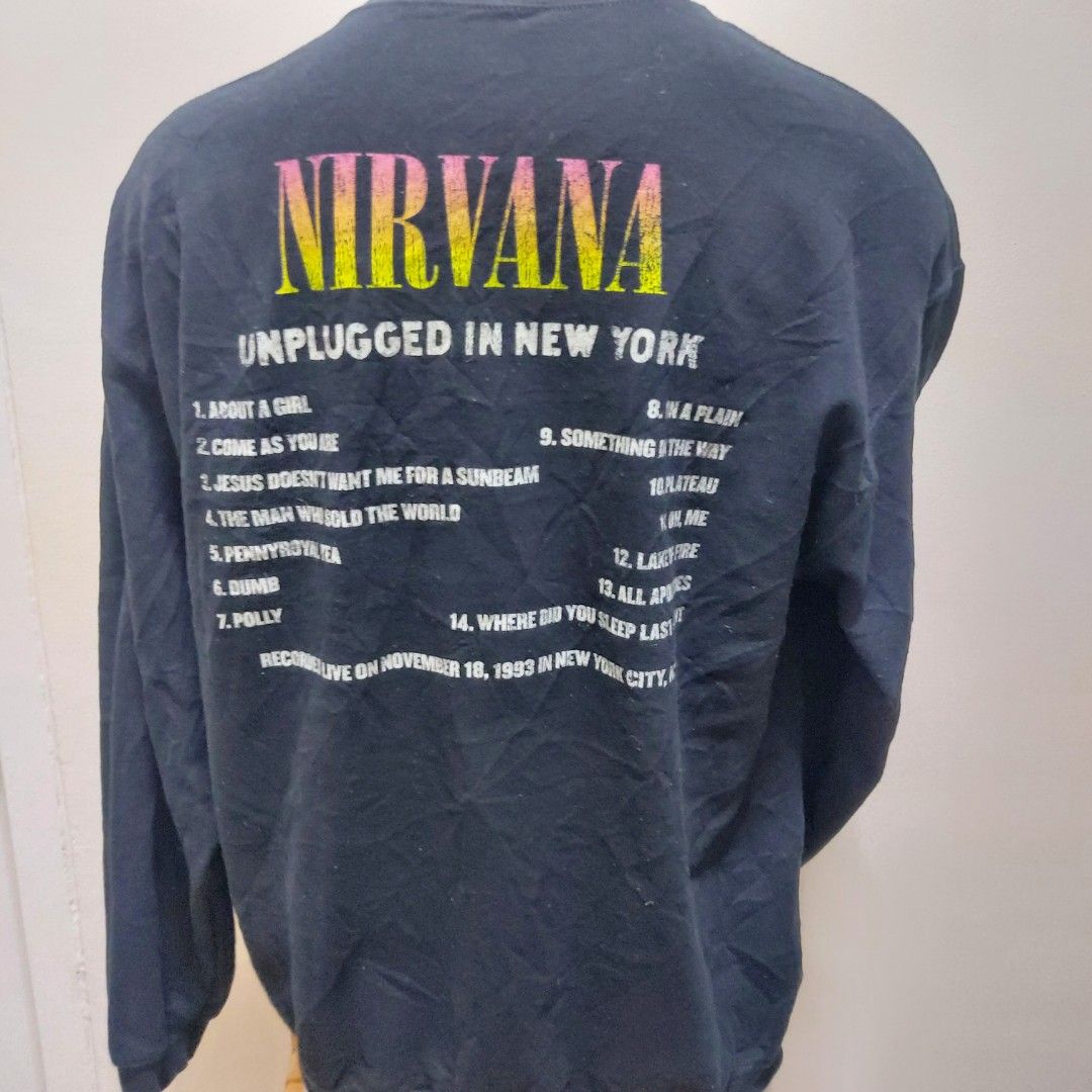Nirvana Unplugged in New York Sweatshirt (Category: Coats, Jackets and Outerwear) located in Muntinlupa City. Submitted by rigoutmafia (Listing ID 1408083324, Image 2). Description: Black Nirvana Unplugged in New York sweatshirt. Features a graphic on the front and a tracklist on the back. Made of 50% cotton and 50% polyester. Size L. Recorded live on November 18, 1993 in New York City..
