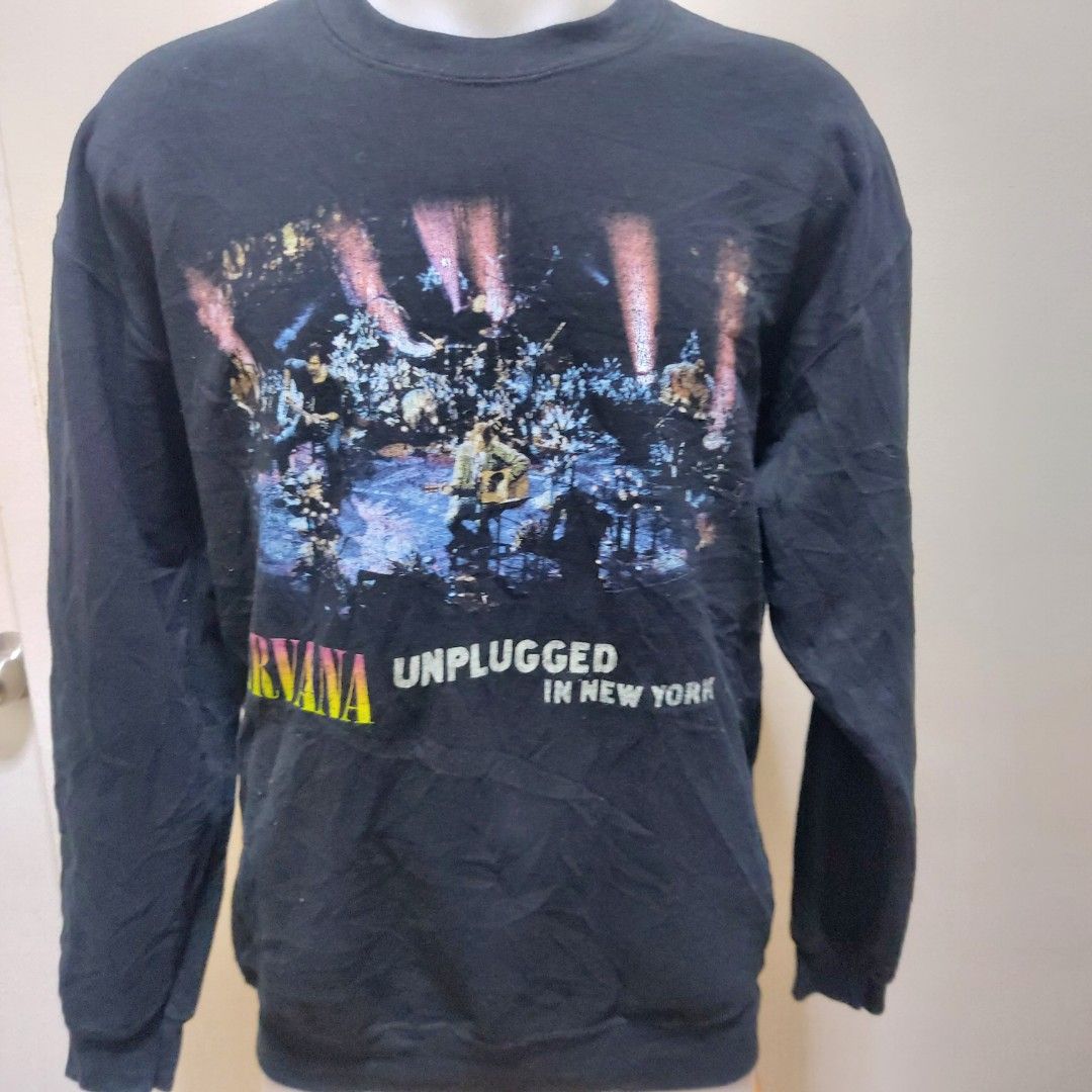 Nirvana Unplugged in New York Sweatshirt (Category: Coats, Jackets and Outerwear) located in Muntinlupa City. Submitted by rigoutmafia (Listing ID 1408083324, Image 1). Description: Black Nirvana Unplugged in New York sweatshirt. Features a graphic on the front and a tracklist on the back. Made of 50% cotton and 50% polyester. Size L. Recorded live on November 18, 1993 in New York City..