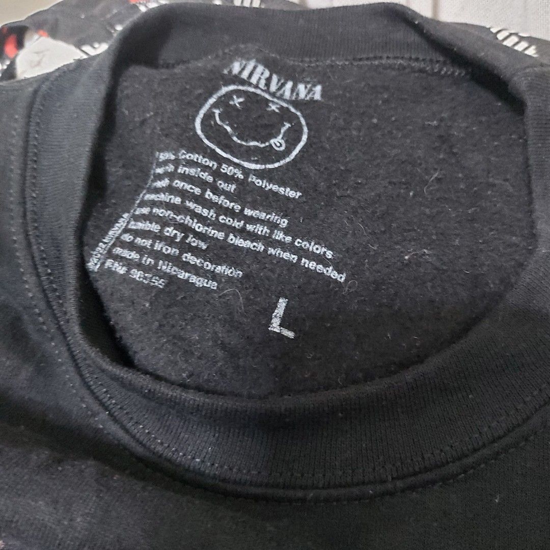 Nirvana Unplugged in New York Sweatshirt (Category: Coats, Jackets and Outerwear) located in Muntinlupa City. Submitted by rigoutmafia (Listing ID 1408083324, Image 3). Description: Black Nirvana Unplugged in New York sweatshirt. Features a graphic on the front and a tracklist on the back. Made of 50% cotton and 50% polyester. Size L. Recorded live on November 18, 1993 in New York City..