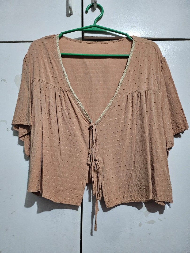 Peach-colored Blouse with Lace Trim plus size 4x (Category: Blouses) located in Angeles City. Submitted by buxom.cheeks (Listing ID 1407987150, Image 1). Description: - Peach-colored blouse - V-neckline - Delicate lace trim - Textured fabric with dot details - Tie closure at front - Short sleeves.
