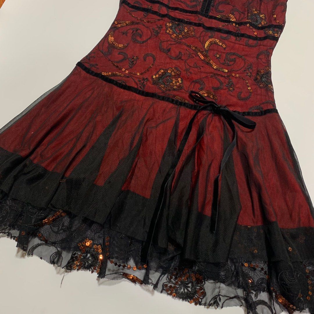 Red and Black Spaghetti Strap Dress (Category: Dresses) located in Bacoor. Submitted by yumeruwu (Listing ID 1408042461, Image 3). Description: - Elegant spaghetti strap dress - Red and black color scheme - V-neckline - Embellished bodice with sequins - Fitted waist - Layered skirt with black tulle overlay and lace trim - Includes a black ribbon tie - Perfect for special occasions.