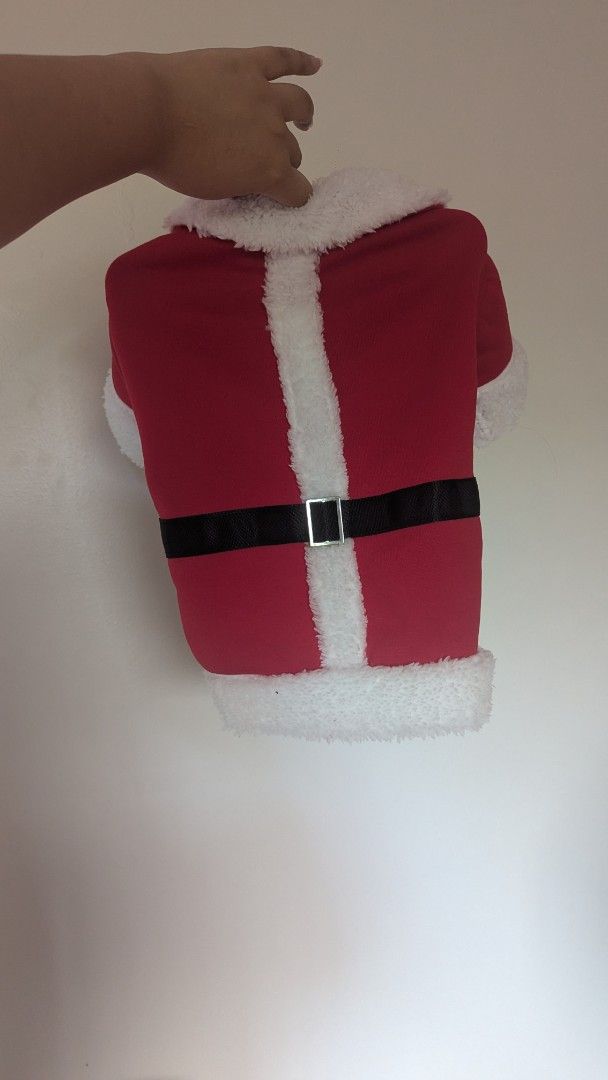 Santa Claus Pet Costume (L) (Category: Homes & Other Pet Accessories) located in San Mateo. Submitted by kittenmallows (Listing ID 1407971285, Image 2). Description: Selling this pet Santa Claus clothing Fits my 4kg cat, but he doesn't really like wearing it, so selling it. - Adorable Santa Claus costume for pets. - Features a red jacket with white fluffy trim. - Includes a black belt with a silver buckle. - Comes with sleeves/arm thingy - Comfor