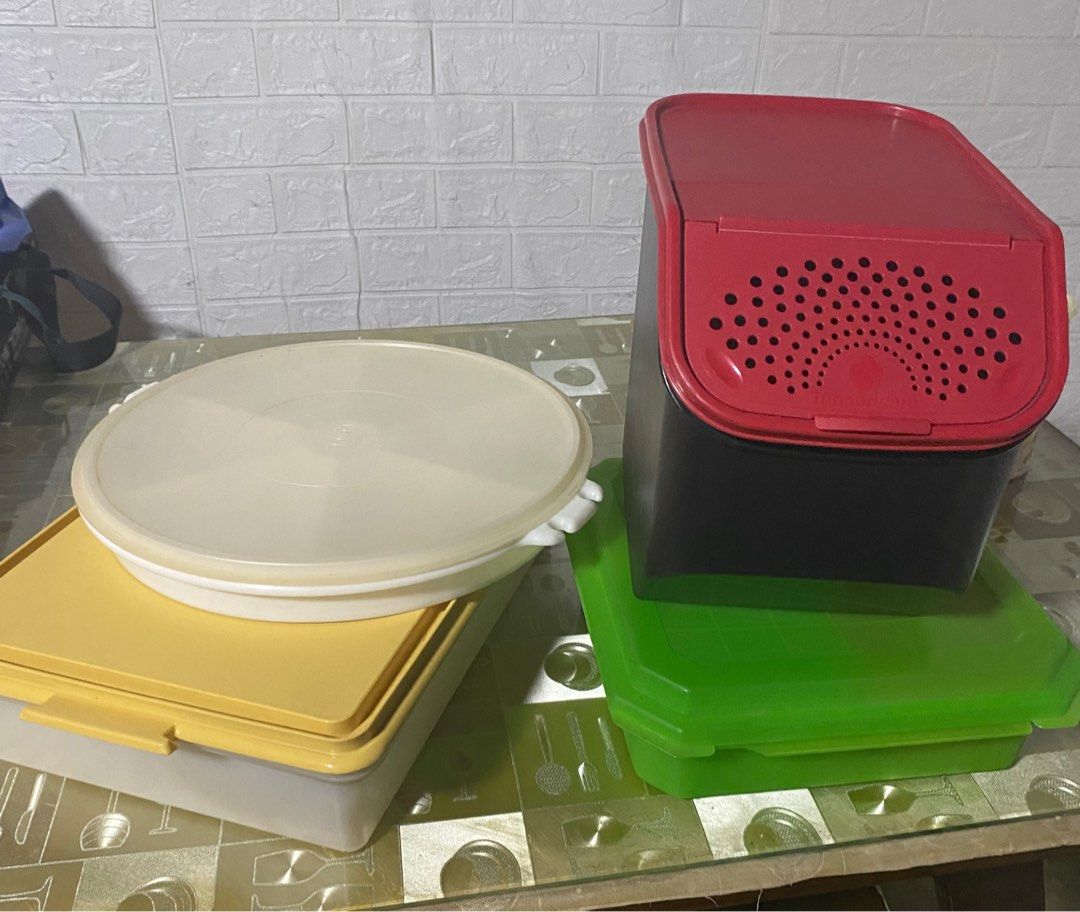 Tupperware storage boxes (Category: Food Organization & Storage) located in Mandaluyong City. Submitted by ianah_mei (Listing ID 1408100942, Image 1). Description: 3pcs Tupperware and 1pc Tupperware-like ( green) Selling for Take All 800.