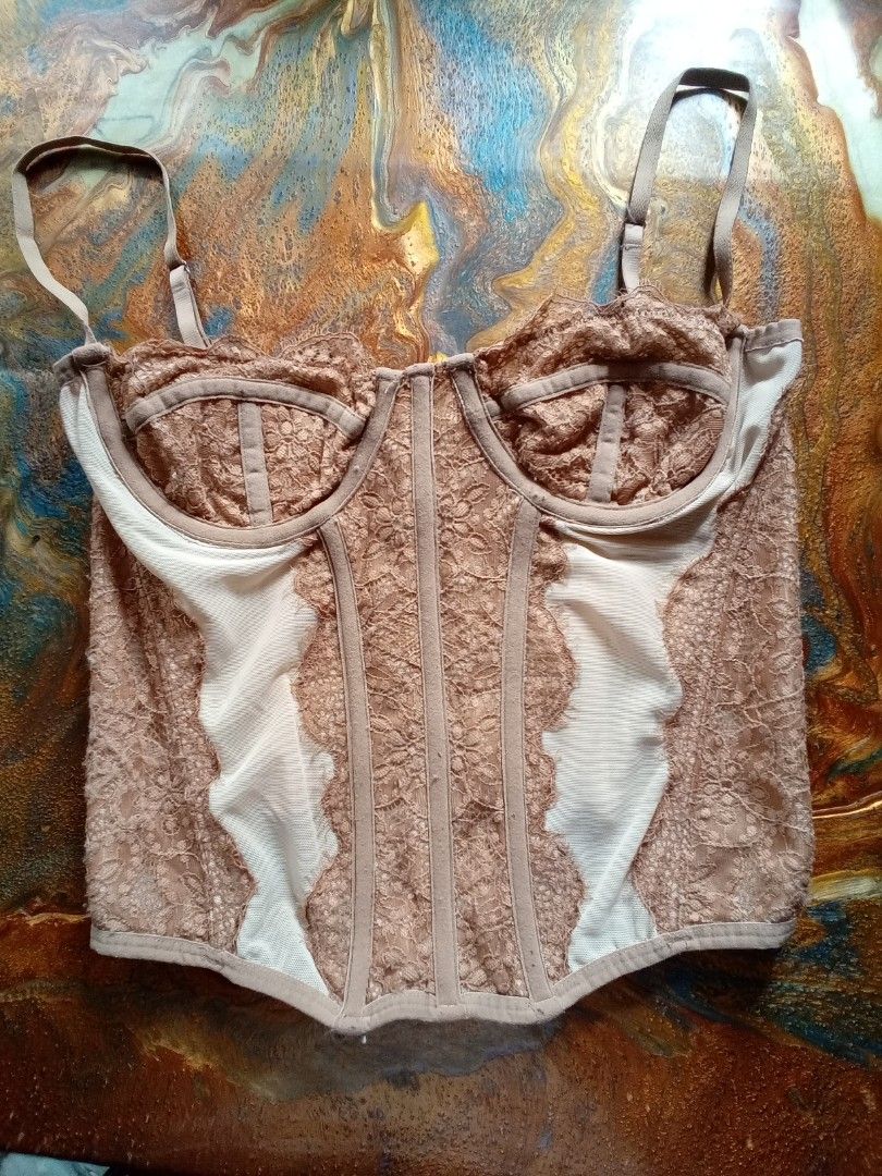 Urban outfitters corset top (Category: Others Tops) located in Quezon City. Submitted by princess_ma (Listing ID 1408065235, Image 1). Description: can fit small-medium bust 32-34 waist 26-28inches with underwired &boning Minimal FLAWS ‼️ may light pink stain sa inner pero di kita o halata sa labas😊 Color nude & light brown combinaton ❤️✨️.