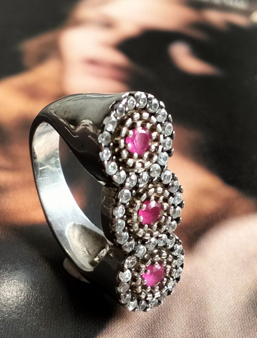 Vintage Silver Ruby Ring (Category: Rings) located in Singapore. Submitted by angielily (Listing ID 1408023909, Image 2). Description: Beautiful statement ring, set with three ruby stones surrounded by sparkling zirconia. The ring size is 8 US or 16 Asian approximately 18mm. Suitable for index finger too. A stunning piece for any jewelry collection. Please see all photos for details, condition and measurements as part of the description. View at 