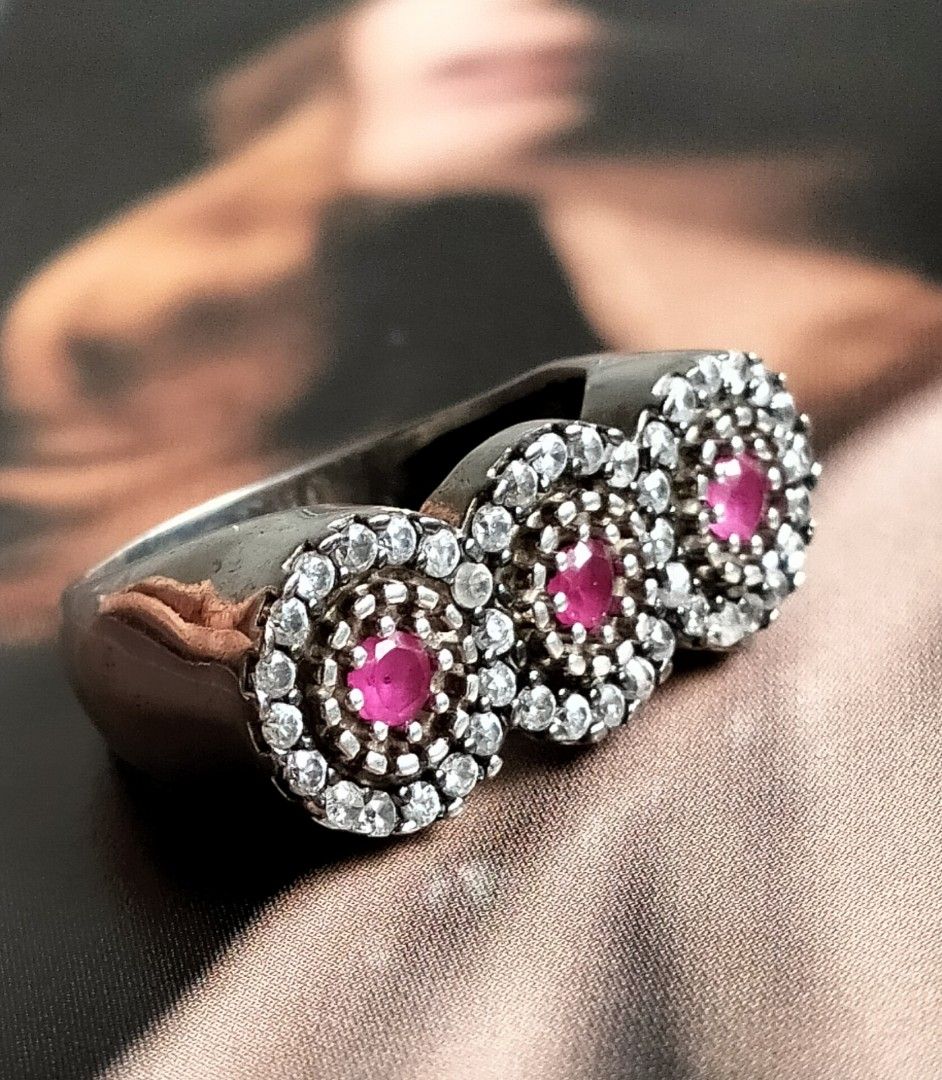 Vintage Silver Ruby Ring (Category: Rings) located in Singapore. Submitted by angielily (Listing ID 1408023909, Image 3). Description: Beautiful statement ring, set with three ruby stones surrounded by sparkling zirconia. The ring size is 8 US or 16 Asian approximately 18mm. Suitable for index finger too. A stunning piece for any jewelry collection. Please see all photos for details, condition and measurements as part of the description. View at 