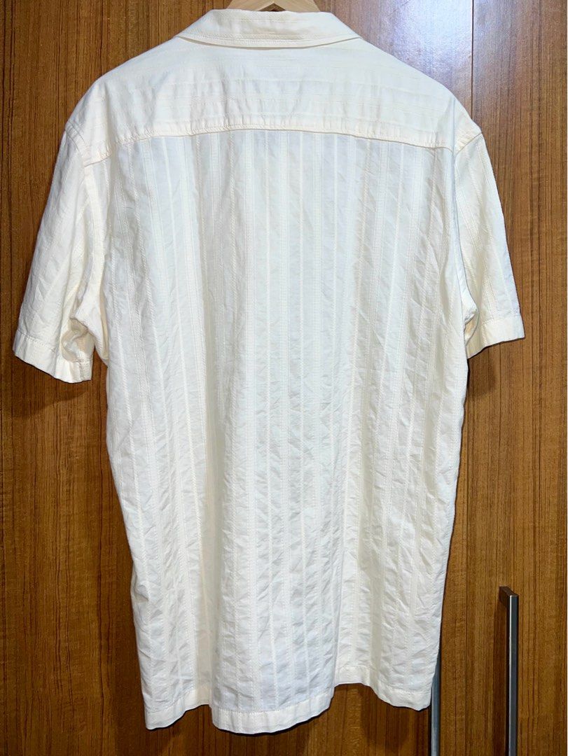 Zara Short Sleeve Shirt (Category: Tshirts & Polo Shirts ) located in Manila. Submitted by drreeves (Listing ID 1408030281, Image 3). Description: - Zara cream shirt - Short sleeves - Camp collar - Vertical stripe pattern - Button-down - Relaxed fit - Worn only twice. Bought for 2700 pesos - Negotiable.
