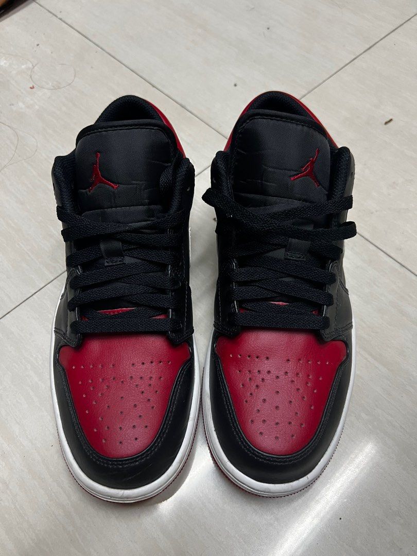Air Jordan 1 Low Alternate Bred Toe (Category: Sneakers) located in Manila. Submitted by kingofthegil (Listing ID 1408255995, Image 1). Description: - Air Jordan 1 Low sneakers - Color: Black and red - Features the iconic Air Jordan logo - Size: 9 - Made in Vietnam - White midsole and black laces.