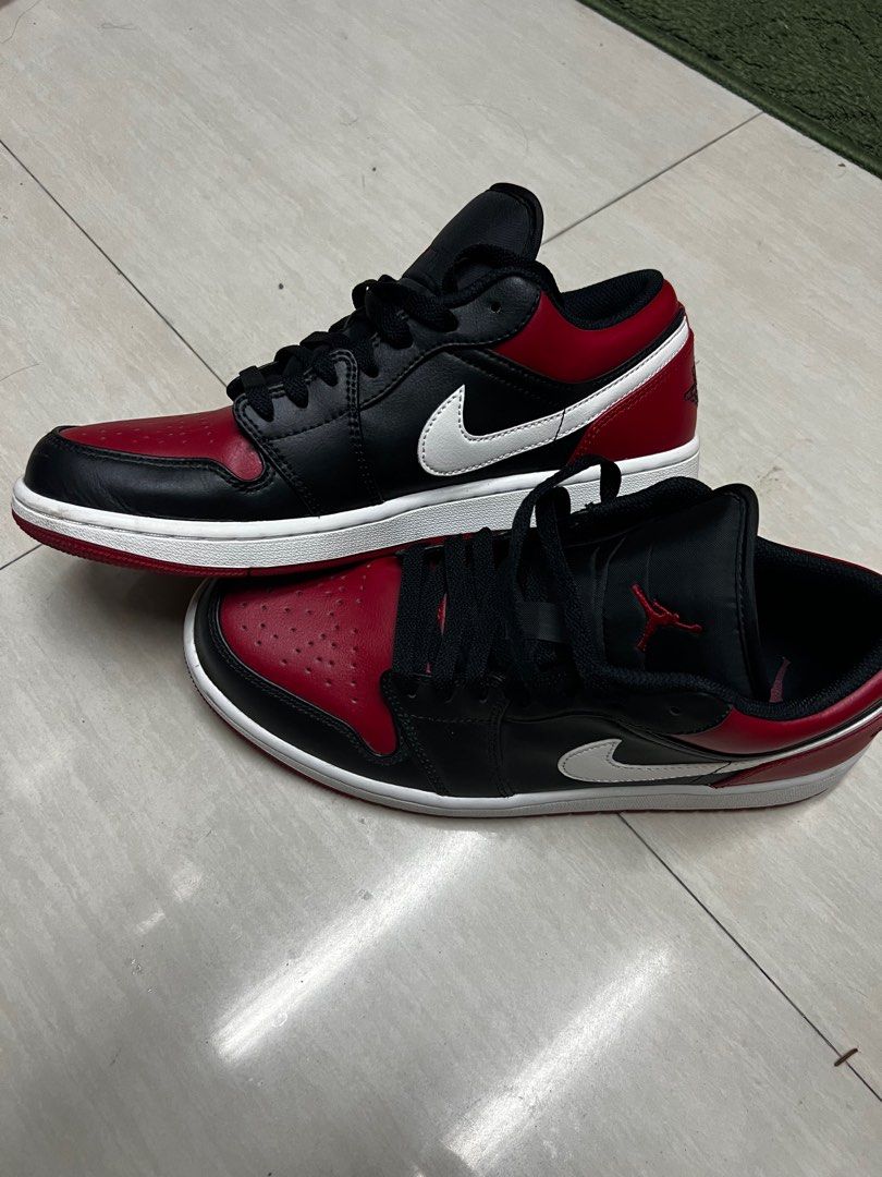 Air Jordan 1 Low Alternate Bred Toe (Category: Sneakers) located in Manila. Submitted by kingofthegil (Listing ID 1408255995, Image 2). Description: - Air Jordan 1 Low sneakers - Color: Black and red - Features the iconic Air Jordan logo - Size: 9 - Made in Vietnam - White midsole and black laces.