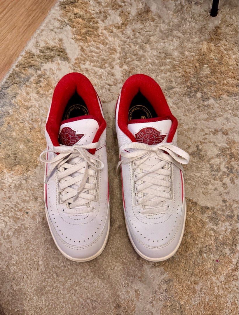 Air Jordan 2 Retro White Red (Category: Sneakers) located in Quezon City. Submitted by arkiolly (Listing ID 1408214258, Image 2). Description: - Air Jordan 2 Retro - White leather upper with red accents - US size 8.5 - Iconic Air Jordan logo on tongue - Some wear on soles.