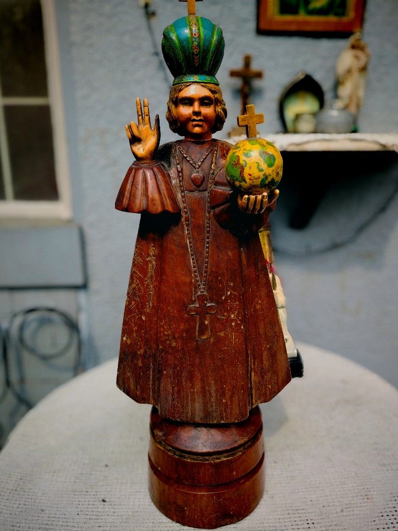 Antique Santo Niño de Cebu Statue (Category: Religious Items) located in Caloocan City. Submitted by josephine09200 (Listing ID 1408297717, Image 1). Description: - Antique Santo Niño Statue - Features a wooden base - Detailed depiction of the Infant Jesus - Adorned with a crown - Holds a globe - Dressed in a long robe - Includes a cross pendant - Religious item INFANT JESUS OF PRAQUE 28 INCHES HEIGHT .