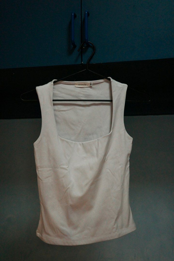Augety Studio White Tank Top - Size S (Category: Sleeveless) located in Quezon City. Submitted by kitkat0328 (Listing ID 1408183549, Image 1). Description: - Augety Studio Tank Top - Size: Small - Color: White - Design: Square neckline, sleeveless - Material: Soft buttery fabric.