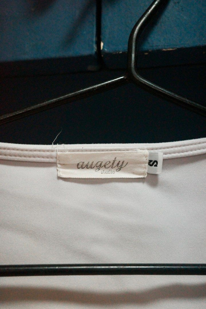 Augety Studio White Tank Top - Size S (Category: Sleeveless) located in Quezon City. Submitted by kitkat0328 (Listing ID 1408183549, Image 2). Description: - Augety Studio Tank Top - Size: Small - Color: White - Design: Square neckline, sleeveless - Material: Soft buttery fabric.