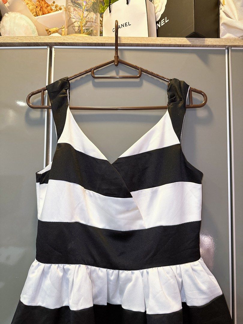 Black and White Striped Dress (Category: Dresses) located in Marikina City. Submitted by prelovedbyerickaa (Listing ID 1408260817, Image 2). Description: – 10/10 🌟 Onhand – No return, no exchange, & no refund 🤍 – SF NOT included – MOP: BDO/ gcash – MOD: lalamove/ j&t - Black and white striped design - V-neckline - Fitted bodice - Flared skirt - Back zipper closure - Size M - Suitable for various occasions.
