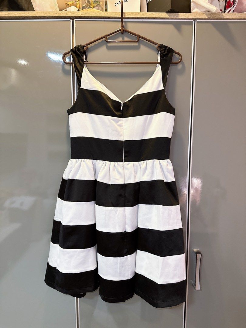 Black and White Striped Dress (Category: Dresses) located in Marikina City. Submitted by prelovedbyerickaa (Listing ID 1408260817, Image 3). Description: – 10/10 🌟 Onhand – No return, no exchange, & no refund 🤍 – SF NOT included – MOP: BDO/ gcash – MOD: lalamove/ j&t - Black and white striped design - V-neckline - Fitted bodice - Flared skirt - Back zipper closure - Size M - Suitable for various occasions.