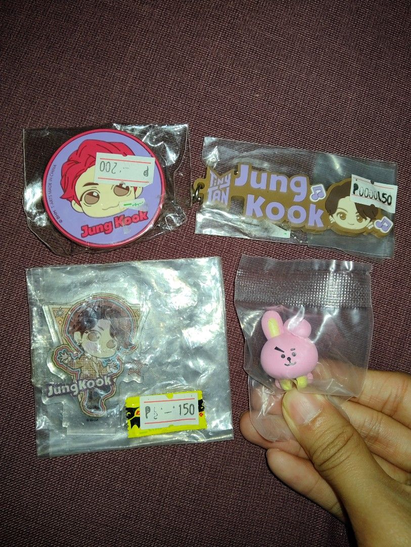 BTS Jungkook Merch Bundle popsocket acrylic standee cooky hugcot (Category: K-Wave Merchandise) located in Pasig City. Submitted by hazelscollectibles (Listing ID 1408276855, Image 1). Description: - BTS Jungkook merchandise bundle - Includes: popsocket keychain, acrylic standee, and Cooky figurine - All items in original packaging - Perfect for BTS fans and collectors - Prices indicated on items take all.