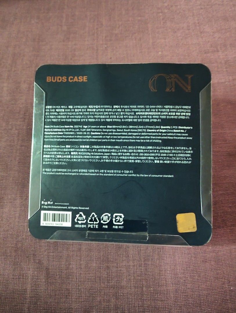 BTS ON Buds Case Samsung buds case (Category: Earphones) located in Pasig City. Submitted by hazelscollectibles (Listing ID 1408255169, Image 2). Description: - Brand new ON Buds Case - Original packaging included - Dark blue and gold color scheme - Decorative pattern design - Square-shaped plastic case - Multi-language text on the back.