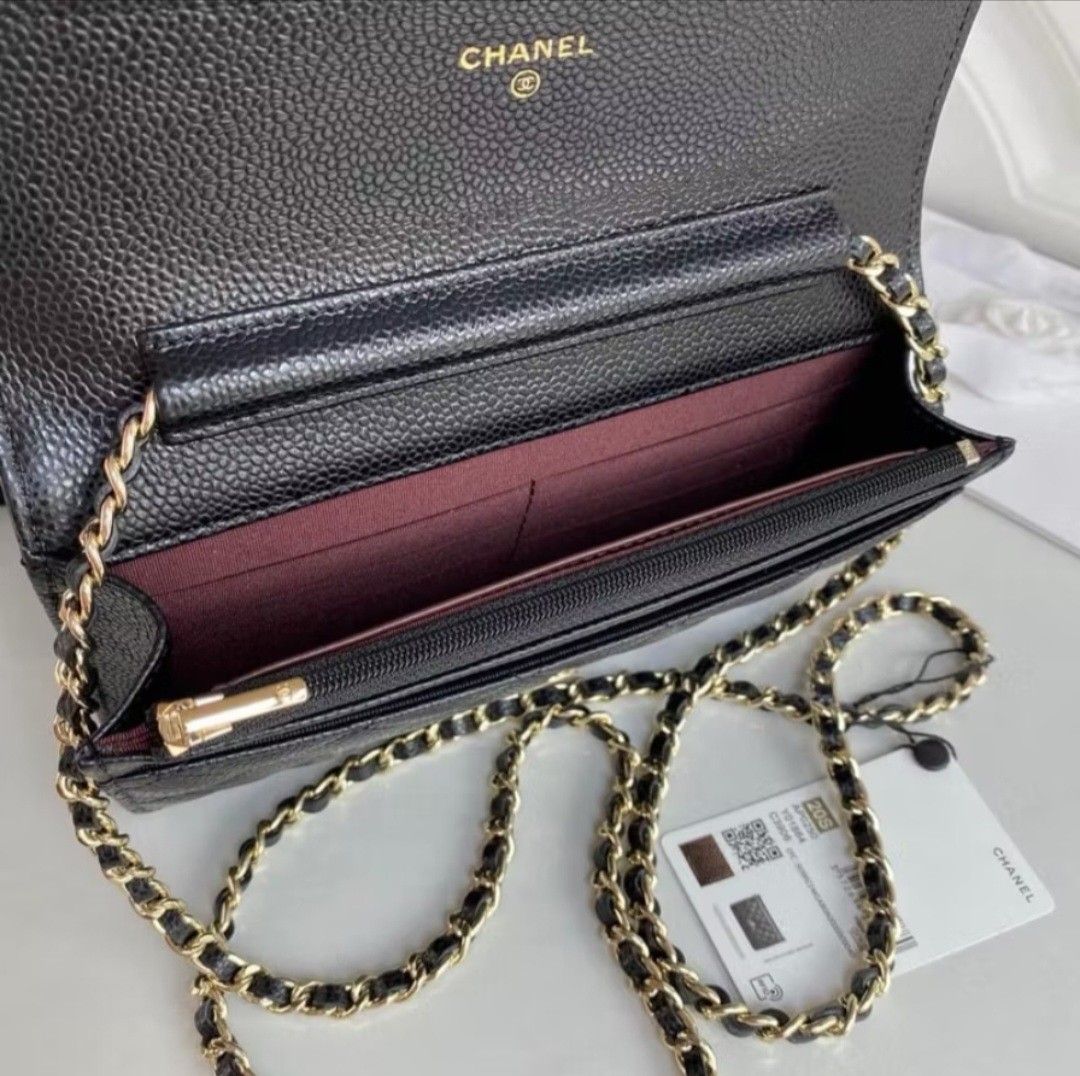 Chanel Quilted Wallet on Chain (Category: Luxury Bags & Wallets) located in Quezon City. Submitted by steph78 (Listing ID 1408145386, Image 3). Description: - Classic black quilted design - Elegant gold-tone chain strap - Features the iconic interlocking CC logo - Comes with original box and dust bag - Interior with multiple compartments and card slots - Secure magnetic snap closure - top grade quality.