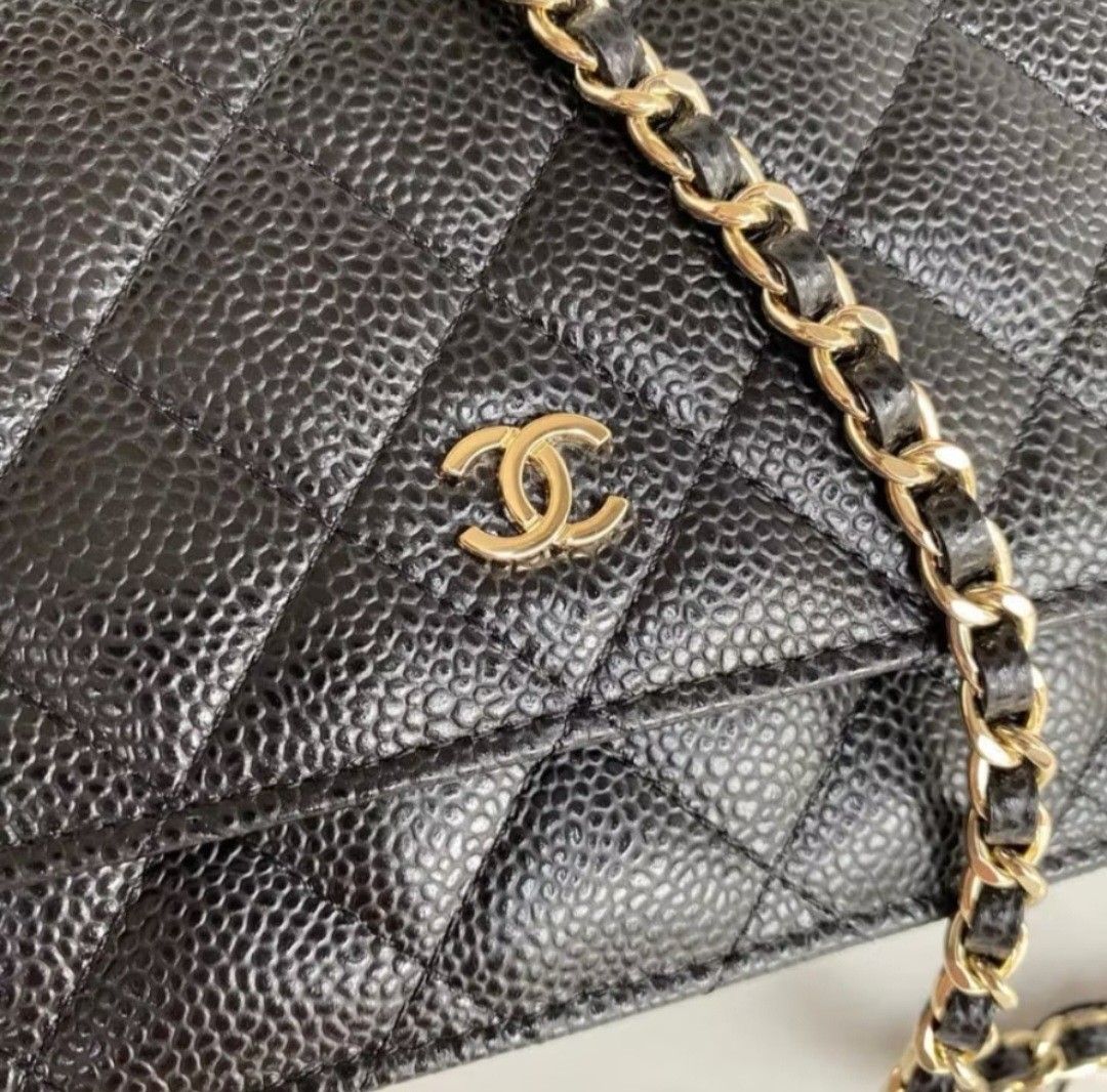 Chanel Quilted Wallet on Chain (Category: Luxury Bags & Wallets) located in Quezon City. Submitted by steph78 (Listing ID 1408145386, Image 2). Description: - Classic black quilted design - Elegant gold-tone chain strap - Features the iconic interlocking CC logo - Comes with original box and dust bag - Interior with multiple compartments and card slots - Secure magnetic snap closure - top grade quality.