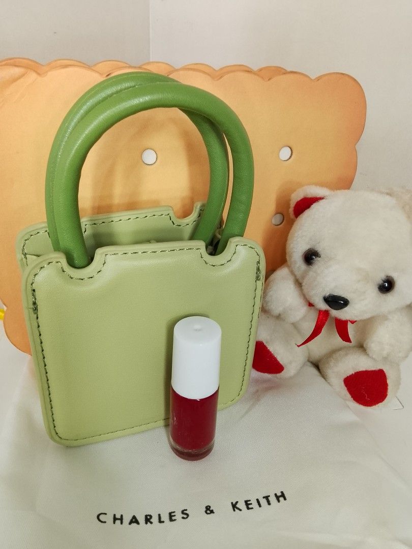 Charles & Keith Micro Bag (Category: Luxury Bags & Wallets) located in Caloocan City. Submitted by glamorouspicks (Listing ID 1406887327, Image 3). Description: Original Price: 2,500 complete set Bought it at 1,650 (no sling) Selling for only 800 pesos (naka display lang) super mura na po nyan kasi with box and dust bag pa. -Mini handbag/slingbag from Charles & Keith. -Pwede din toh collectors item kasi ang cute talaga. -It comes with a dust bag 