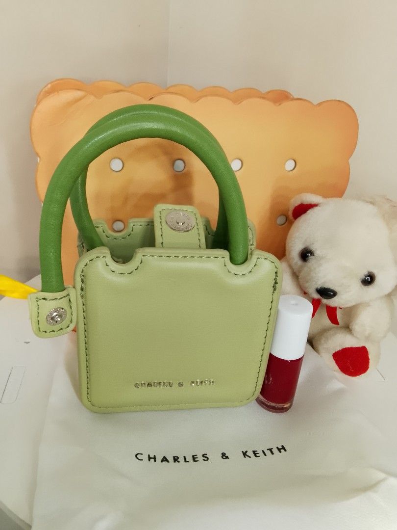 Charles & Keith Micro Bag (Category: Luxury Bags & Wallets) located in Caloocan City. Submitted by glamorouspicks (Listing ID 1406887327, Image 2). Description: Original Price: 2,500 complete set Bought it at 1,650 (no sling) Selling for only 800 pesos (naka display lang) super mura na po nyan kasi with box and dust bag pa. -Mini handbag/slingbag from Charles & Keith. -Pwede din toh collectors item kasi ang cute talaga. -It comes with a dust bag 
