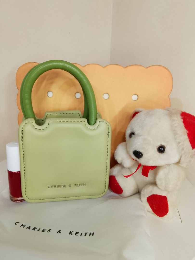 Charles & Keith Micro Bag (Category: Luxury Bags & Wallets) located in Caloocan City. Submitted by glamorouspicks (Listing ID 1406887327, Image 1). Description: Original Price: 2,500 complete set Bought it at 1,650 (no sling) Selling for only 800 pesos (naka display lang) super mura na po nyan kasi with box and dust bag pa. -Mini handbag/slingbag from Charles & Keith. -Pwede din toh collectors item kasi ang cute talaga. -It comes with a dust bag 