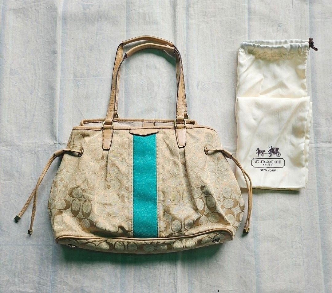 Coach Signature Stripe Drawstring Carryall (Category: Shoulder Bags) located in Baguio. Submitted by grumpygranny (Listing ID 1408240271, Image 1). Description: measurements: 17.5" X 9.4" (base 5.9") WYSIWYT..item is exactly as listed. ➡️ please purchase with the understanding that this is a USED item. if you are sensitive to this condition, please do not purchase. ➡️ please check my profile, only those who understand are welcome to purchase..
