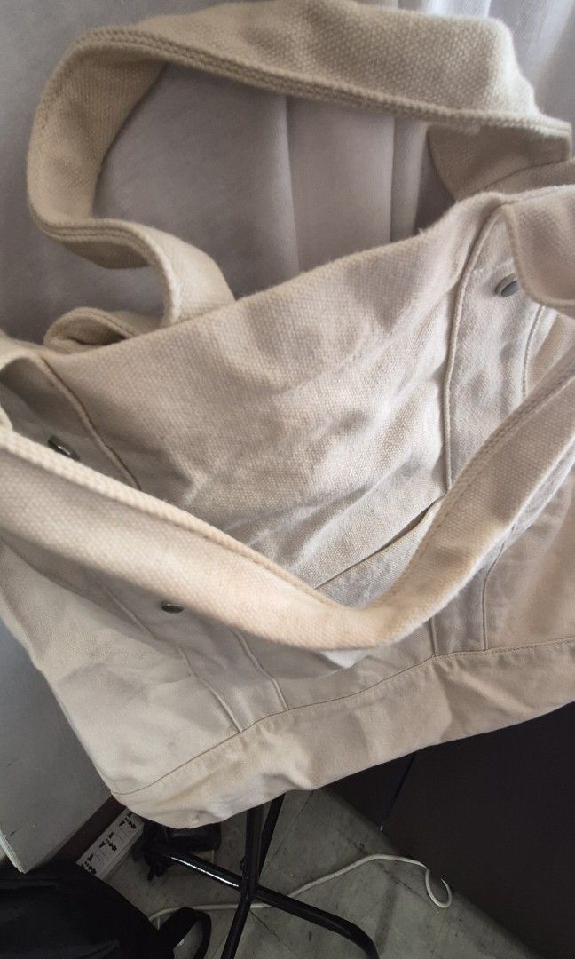 Cross-body bag cream (Category: Cross-body Bags) located in Caloocan City. Submitted by celonessentials (Listing ID 1408187130, Image 2). Description: Bought this in Australia lightly used but with light brown stain from storage(last pic) tha bag can fit a small to medium laptop Canvass material so nice in person.