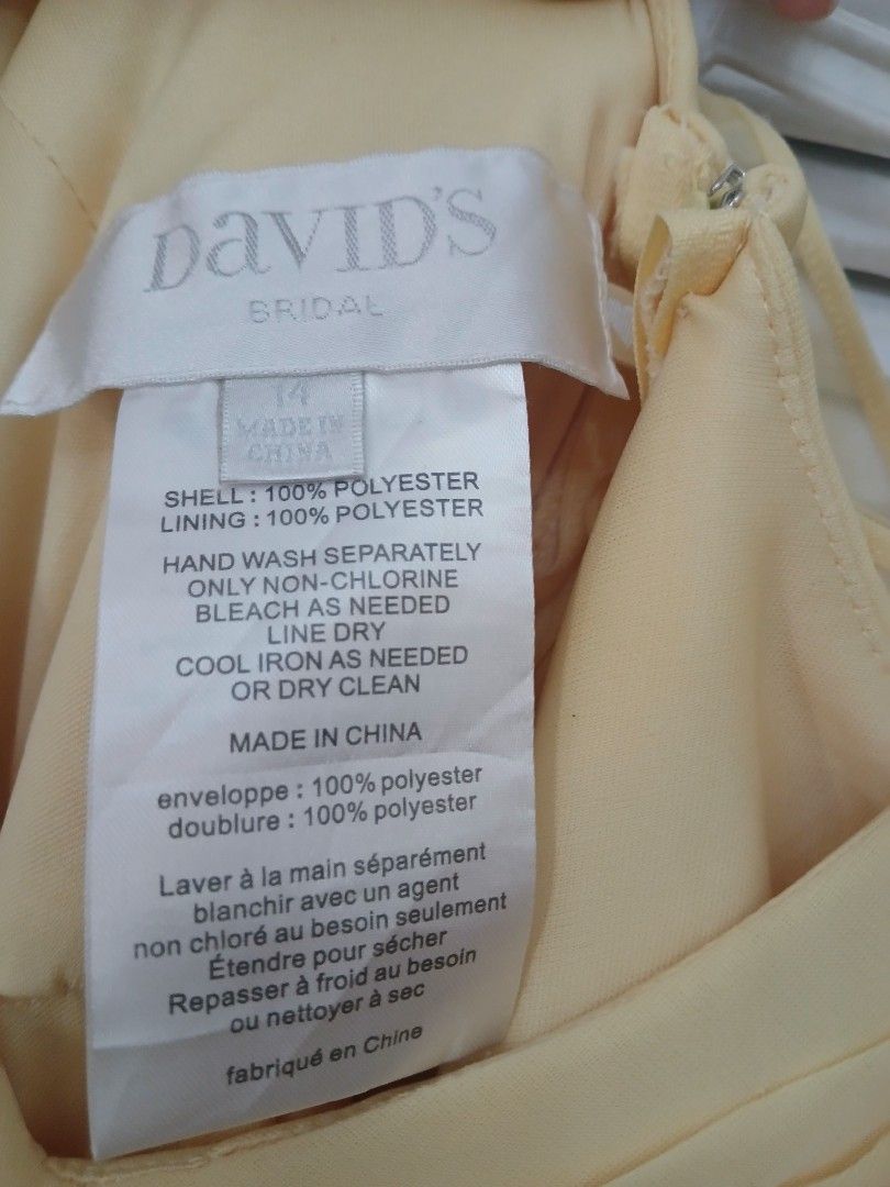 David's Bridal Yellow Dress (Category: Dresses) located in Manila. Submitted by isimostar (Listing ID 1408203244, Image 3). Description: - Used only 1-2 times - RFS: No longer fits - Size 14 - V-neck design - Flowing, pleated skirt - 100% polyester - Made in China - Ideal for special occasions - Lightweight fabric.