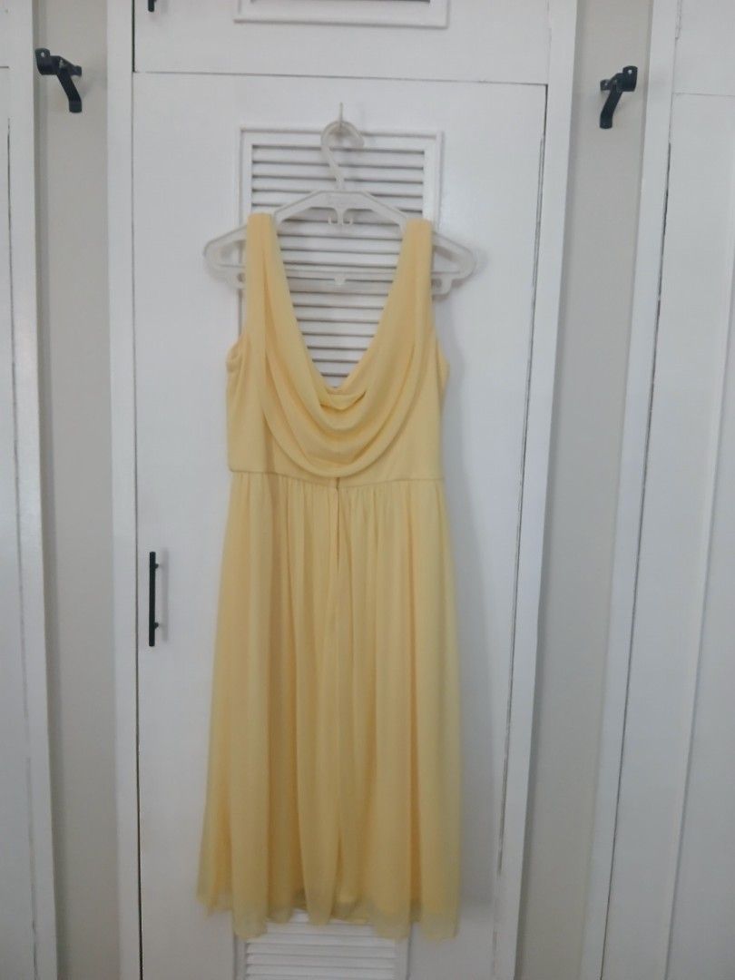 David's Bridal Yellow Dress (Category: Dresses) located in Manila. Submitted by isimostar (Listing ID 1408203244, Image 2). Description: - Used only 1-2 times - RFS: No longer fits - Size 14 - V-neck design - Flowing, pleated skirt - 100% polyester - Made in China - Ideal for special occasions - Lightweight fabric.