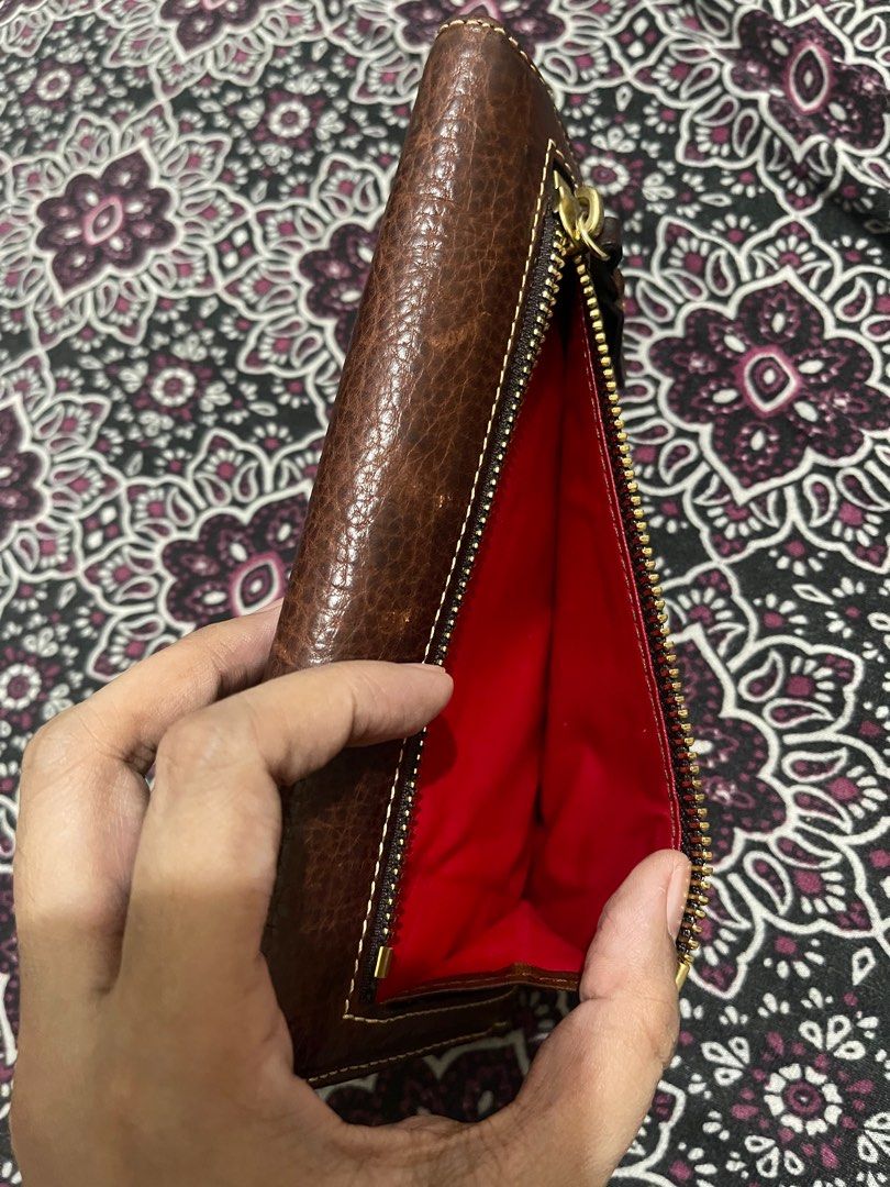 Dooney and Bourke Trifold Long Wallet (Category: Luxury Bags & Wallets) located in Quezon City. Submitted by minekoh21 (Listing ID 1408280968, Image 3). Description: - Authentic Dooney & Bourke - Premium leather exterior with classic stitching - Trifold long design for generous storage - Multiple card slots, slip pockets, and full-length bill compartment with extra check - Removable checkbook pocket for added versatility - Secure snap closure - S