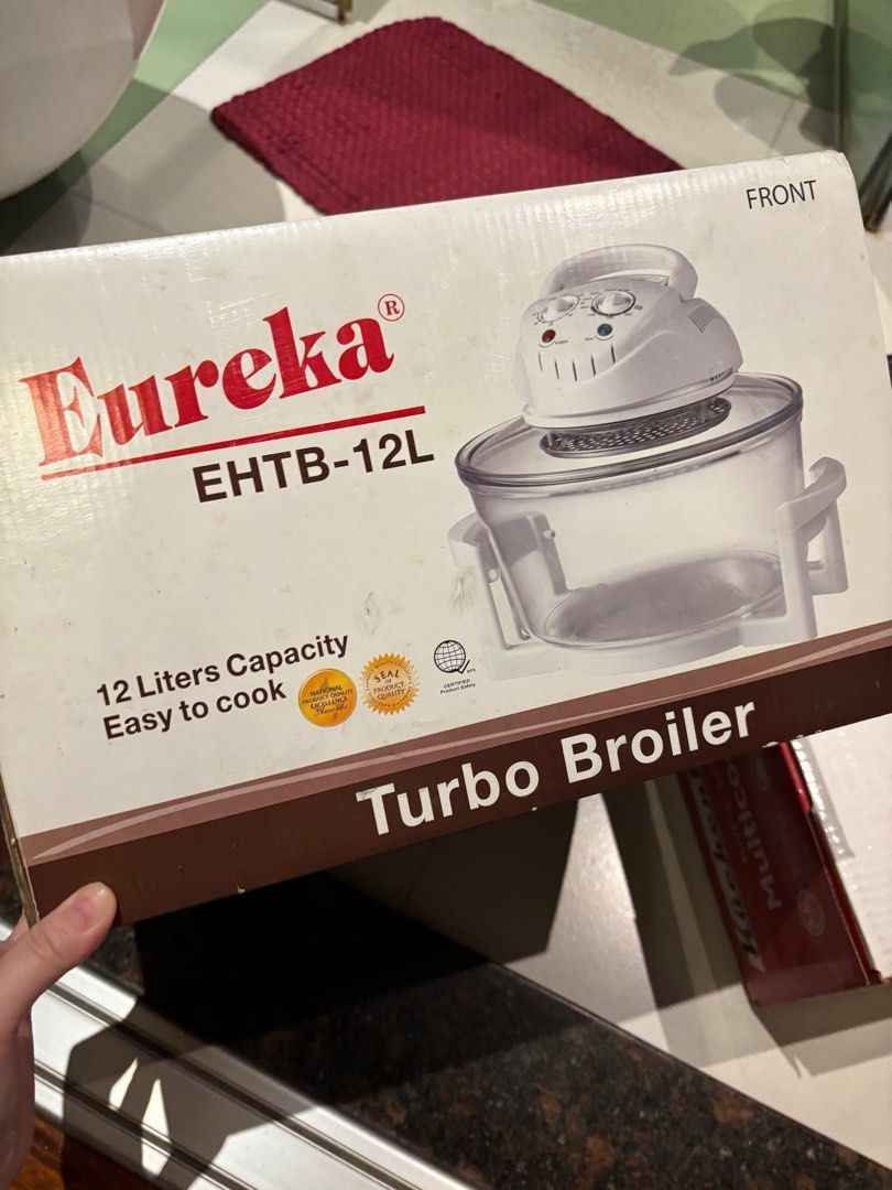 Eureka EHTB-12L Turbo Broiler (Category: Cookware & Accessories) located in Manila. Submitted by pepper7779 (Listing ID 1408223788, Image 1). Description: Eureka EHTB-12L Turbo Broiler with 12 liters capacity. It can cook a variety of foods like brochettes, chicken, steak, fish, vegetables, French fries, and potatoes. Features adjustable thermostat from 60 to 250 degrees Celsius and a timer up to 60 minutes. The bowl and accessories are dishwashe