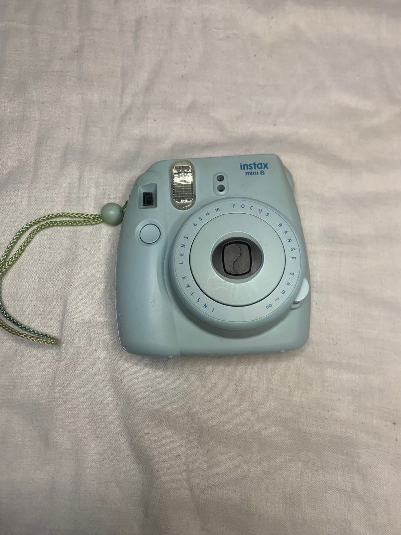 Fujifilm Instax Mini 8 Camera (Category: Cameras) located in Manila. Submitted by lustreloom (Listing ID 1408179563, Image 2). Description: - Fujifilm Instax Mini 8 instant camera - Mint green color - Includes matching camera case and strap - 60mm focus lens - Ready to capture photos.