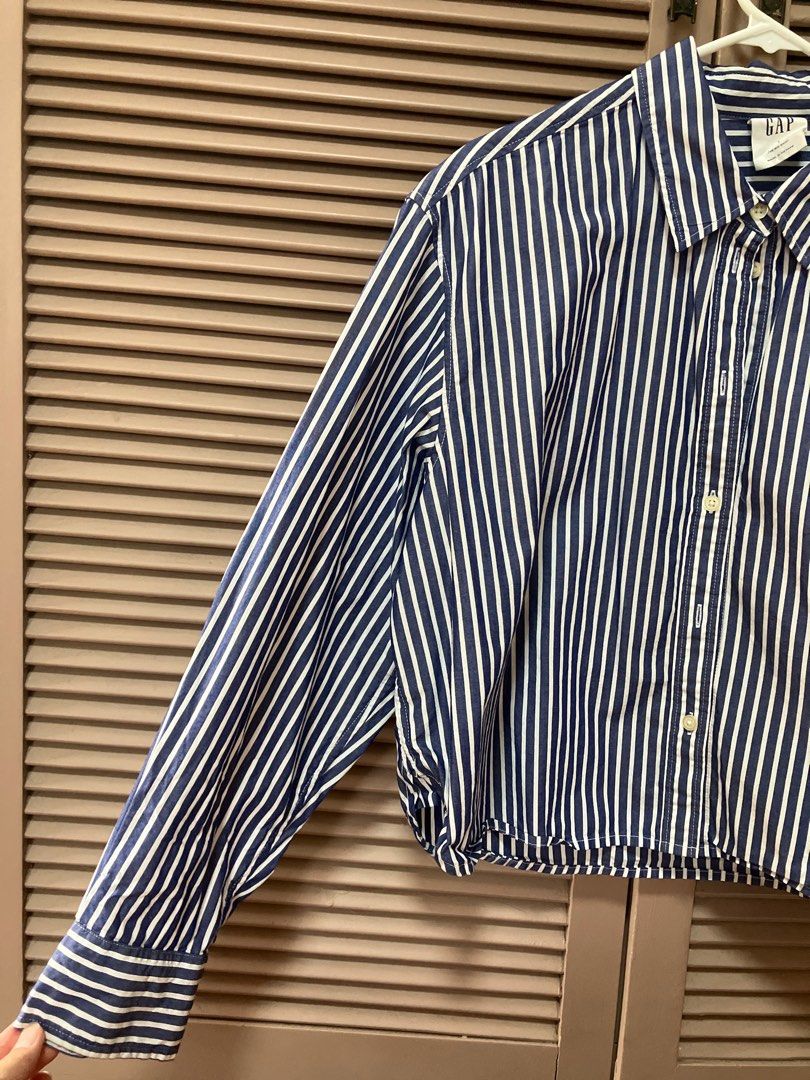 GAP Striped Shirt - Large (Category: Longsleeves) located in Binan City. Submitted by mrsjca (Listing ID 1408161363, Image 2). Description: - GAP striped shirt, crop top - Size: Large - Features: Button-down front, long sleeves - Color: Blue and white stripes - Made in Vietnam.