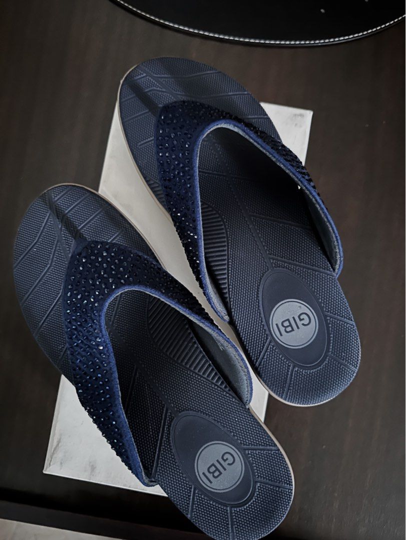 Gibi Flip-flops with Rhinestones (Category: Slippers and slides) located in Quezon City. Submitted by spatio (Listing ID 1408181202, Image 3). Description: Elegant Gibi flip-flops in navy blue. Features a strap adorned with rhinestones. The sole has a textured design for grip. Comes with the original box. Size 37. Originally bought at 1699. .