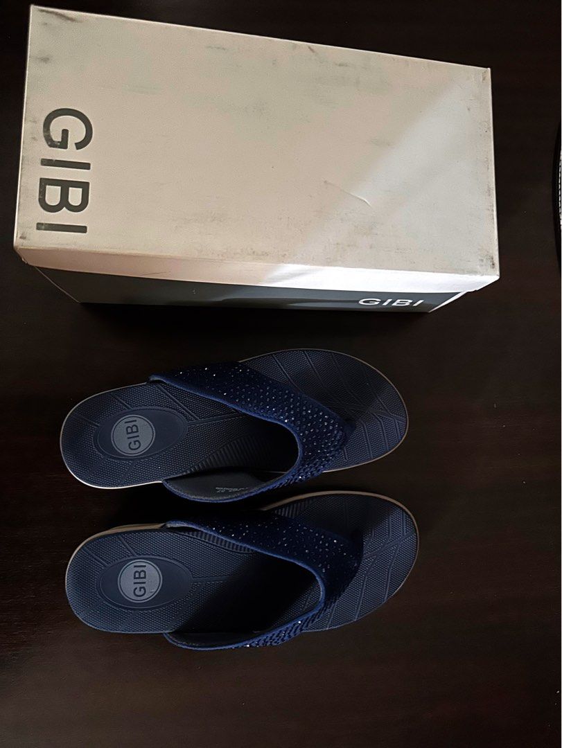 Gibi Flip-flops with Rhinestones (Category: Slippers and slides) located in Quezon City. Submitted by spatio (Listing ID 1408181202, Image 1). Description: Elegant Gibi flip-flops in navy blue. Features a strap adorned with rhinestones. The sole has a textured design for grip. Comes with the original box. Size 37. Originally bought at 1699. .