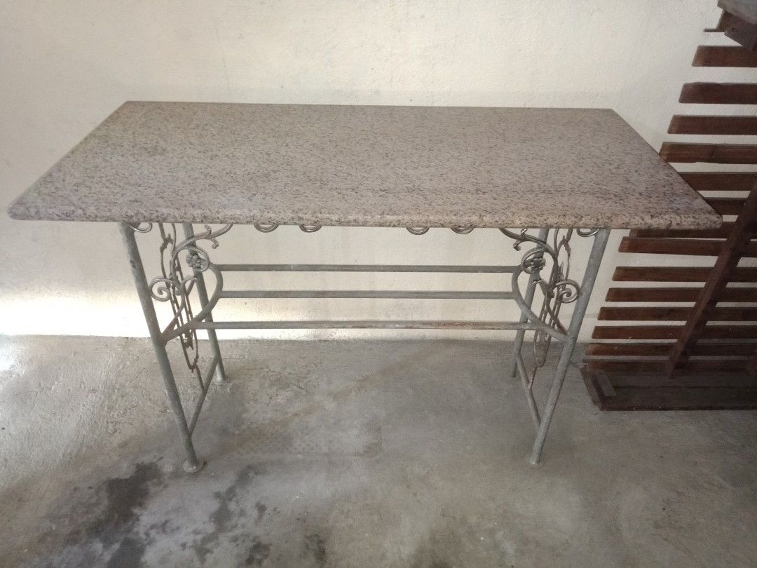 Granite Bar Table (Category: Tables & Sets) located in Taytay. Submitted by rulertrade (Listing ID 1408122159, Image 1). Description: Preloved item Custom-made Real granite stone top (not faux or laminate) Heavy duty Dimension: 2 ft by 4 ft Granite thickness: 2 inches Base stand made of steel pipes Heavy duty Dimension: Height 95 cm Length 111 cm Width 40 cm Granite top is detached from base for easy moving and transport This is also ideal as an 