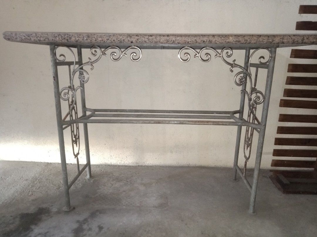 Granite Bar Table (Category: Tables & Sets) located in Taytay. Submitted by rulertrade (Listing ID 1408122159, Image 3). Description: Preloved item Custom-made Real granite stone top (not faux or laminate) Heavy duty Dimension: 2 ft by 4 ft Granite thickness: 2 inches Base stand made of steel pipes Heavy duty Dimension: Height 95 cm Length 111 cm Width 40 cm Granite top is detached from base for easy moving and transport This is also ideal as an 