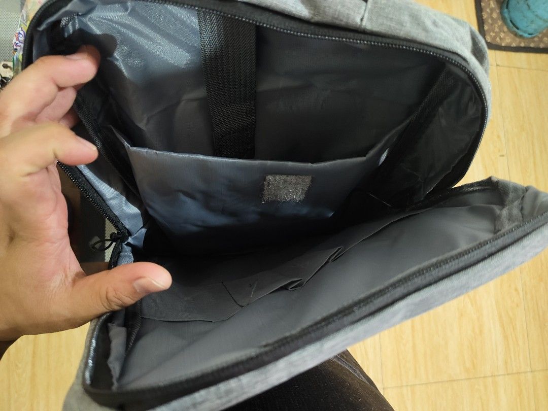 Gray Backpack (Category: Backpacks) located in Manila. Submitted by deleonaj182 (Listing ID 1408122295, Image 3). Description: - Gray backpack - Brand New - Front pocket - Adjustable straps - Spacious interior with multiple compartments - Durable material - Sleek design - Dimensions: Approximately 12" wide x 16" tall - Suitable for everyday use.