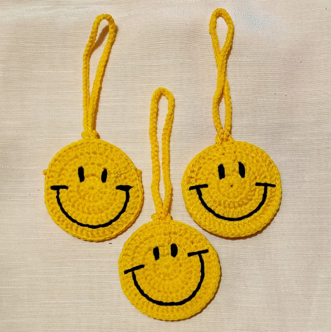Handmade Crochet Happy Face Pouch Bag Charm (Category: Other Home Decor) located in Binan City. Submitted by _joyce_a (Listing ID 1408169505, Image 1). Description: Add a pop of personality to your keys, tote bag, backpack, or everyday essentials with our Handmade Crochet Happy Face Pouch Bag Charm. Each piece is carefully crocheted by hand, giving it a soft, charming, and handcrafted look you won’t find in mass-produced accessories. For more inq