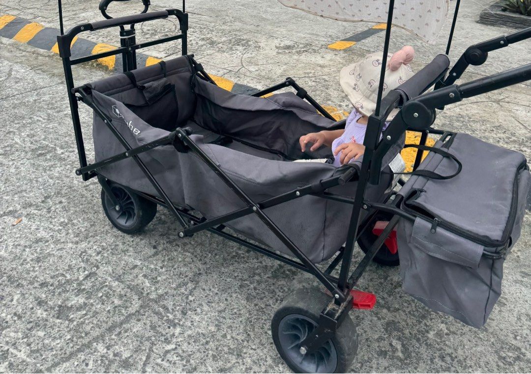 Heavy duty Wagon / Trolley - Camping (Category: Strollers) located in Cavite. Submitted by mom_declutters111 (Listing ID 1408176531, Image 1). Description: Foldable, has seatbelts and compartments. Large tires, can be used in bumpy roads/camping. Heavy duty large foldable wagon / trolley Originally bought for P15,000. Decluttering, PM if interested. Selling for P6k .