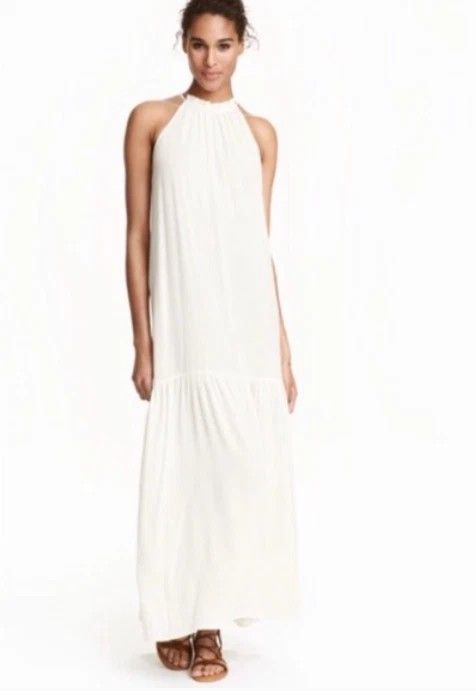 H&M White Halter Maxi Dress (Category: Dresses) located in Taguig. Submitted by schnitka (Listing ID 1408245605, Image 1). Description: - H&M white halter maxi dress - Flowing, tiered design - High neckline - Relaxed fit - Ideal for casual outings or beach vacations - Lightweight fabric -Can fit to large frame .