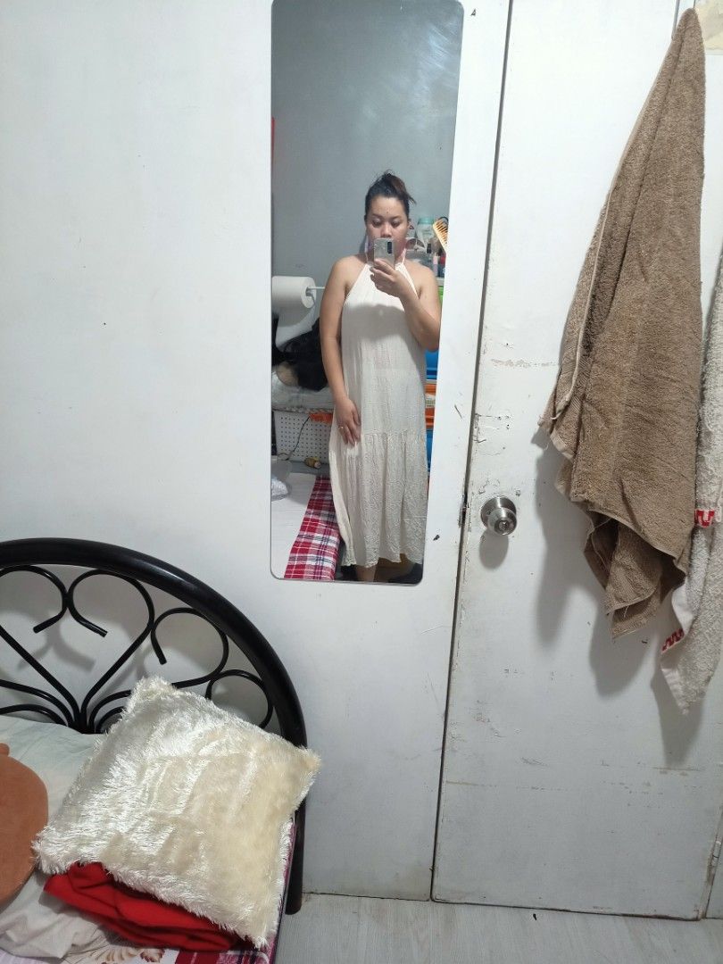 H&M White Halter Maxi Dress (Category: Dresses) located in Taguig. Submitted by schnitka (Listing ID 1408245605, Image 2). Description: - H&M white halter maxi dress - Flowing, tiered design - High neckline - Relaxed fit - Ideal for casual outings or beach vacations - Lightweight fabric -Can fit to large frame .