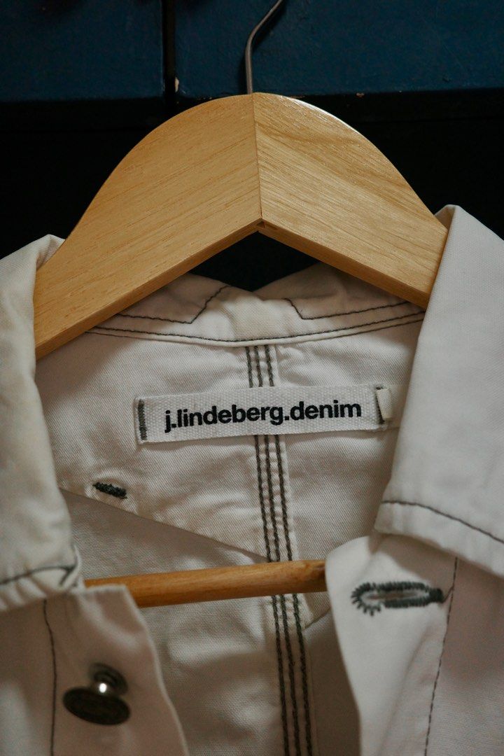 J. Lindeberg Denim White Jacket (Category: Coats, Jackets and Outerwear) located in Quezon City. Submitted by kitkat0328 (Listing ID 1408181695, Image 2). Description: - J. Lindeberg white denim jacket - Button closures - Two chest pockets - Classic collar - Black stitching details - Tailored back design - Condition: Visible stains present.