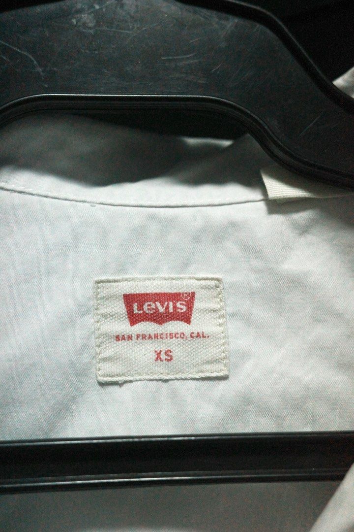 Levi's Alfie Shirt XS (Category: Shirts) located in Quezon City. Submitted by kitkat0328 (Listing ID 1408217480, Image 2). Description: - Levi's white oversized shirt - Size: XS - Features a chest pocket with the Levi's red tab - Button-down closure - Classic collar - Made in San Francisco, California - only worn once.