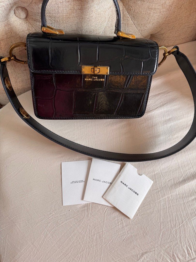 Marc Jacobs The Box Bag (Category: Luxury Bags & Wallets) located in Talisay. Submitted by myclosetxoxo. (Listing ID 1408131936, Image 2). Description: - Authentic Marc Jacobs The Box Bag - Color: Black - Features: - Top handle - Detachable shoulder strap - Croc-embossed finish - Gold-tone hardware - Includes authenticity cards -no return no exchange policy.
