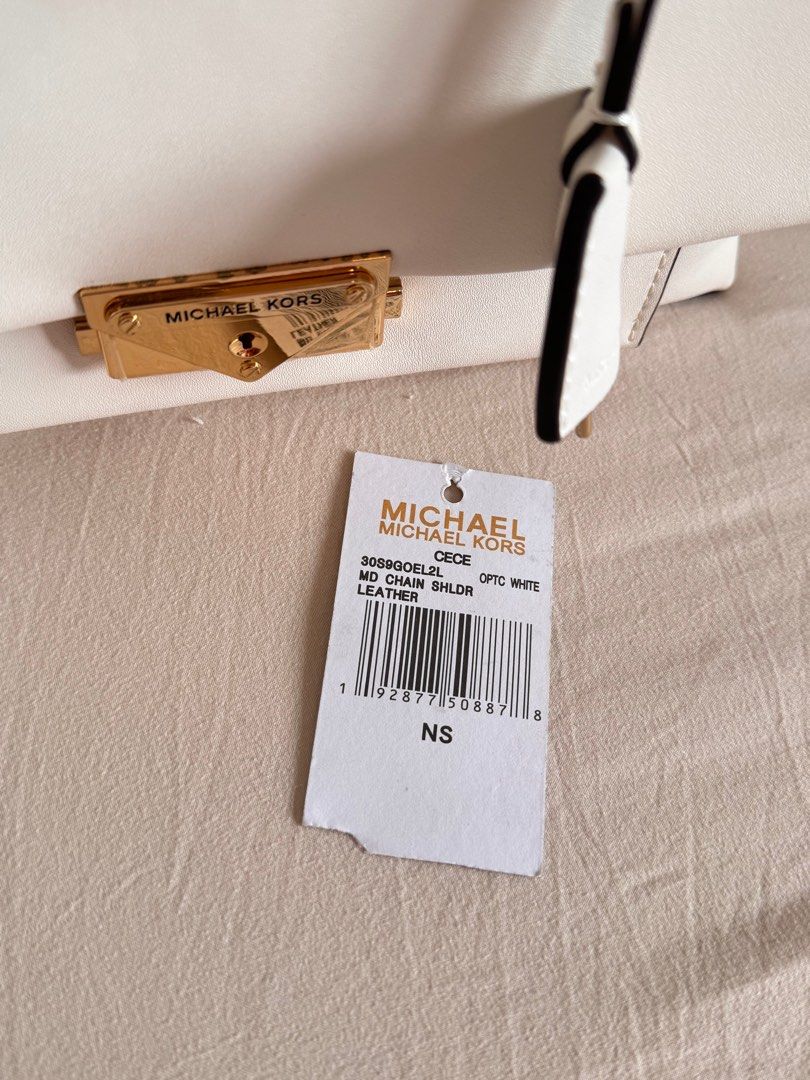 Michael Kors Cece MD Chain Shldr Optic White Leather (Category: Luxury Bags & Wallets) located in Talisay. Submitted by myclosetxoxo. (Listing ID 1408131603, Image 3). Description: - Authentic Michael Kors Cece shoulder bag - Optic white leather - Gold-tone chain strap and hardware - Flap closure with turn-lock - Includes detachable tag - Interior: zippered pocket and slip pocket - New with tags.