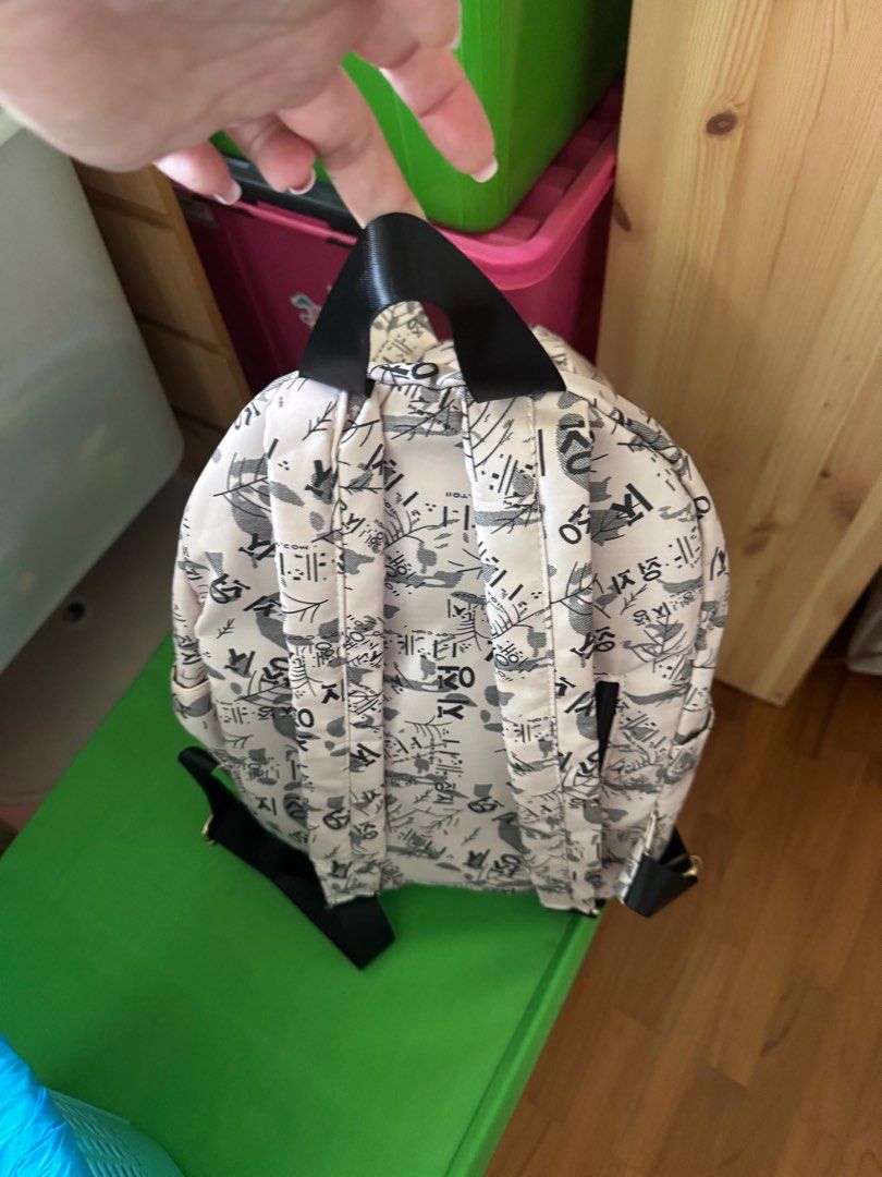 Mickey Mouse Patterned Backpack (Category: Backpacks) located in Singapore. Submitted by joyvous (Listing ID 1408119181, Image 2). Description: - Mickey Mouse design - Front zipper pocket - Adjustable straps - Minimal wear - Stylish and functional.