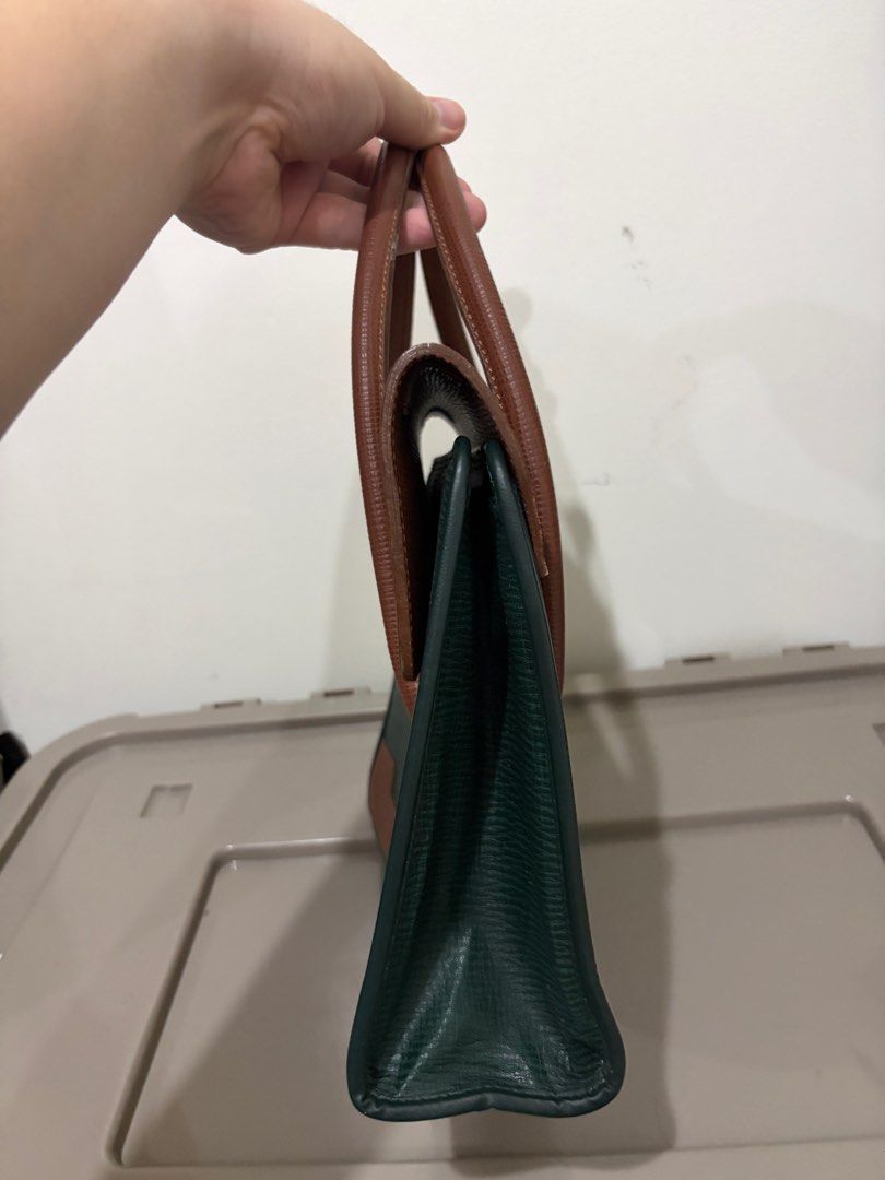 Philippe Charriol Handbag (Category: Luxury Bags & Wallets) located in Mandaluyong City. Submitted by bookmarkdown (Listing ID 1408190208, Image 3). Description: - Authentic - Stylish two-tone design (brown and green) - Two top handles - Rectangular shape - Interior zippered pocket - Gold-toned logo - Gold accents on handles.