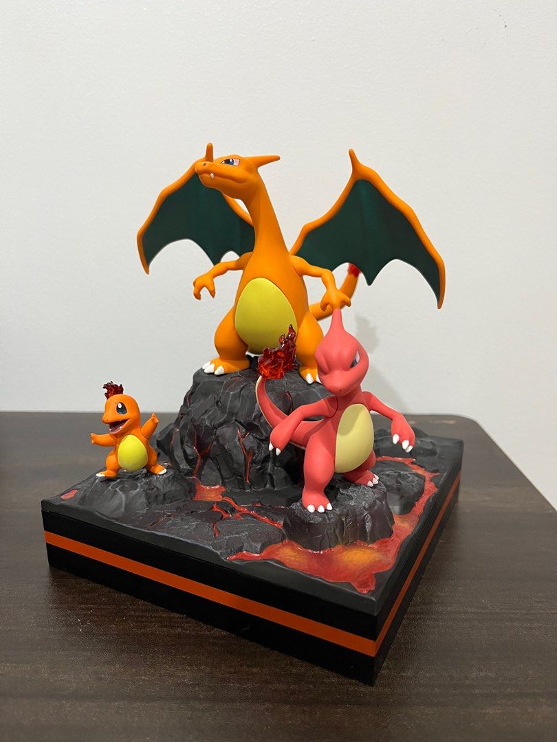 Pokemon Charizard Evolution Figurine (Category: Figurines & Statues) located in Manila. Submitted by mixtibles (Listing ID 1408238553, Image 2). Description: - Features the complete Charizard evolution line: Charmander, Charmeleon, and Charizard. - Displayed on a unique lava-themed base. - Includes original box. - A must-have collectible for Pokemon enthusiasts. - Not authentic but quality. .